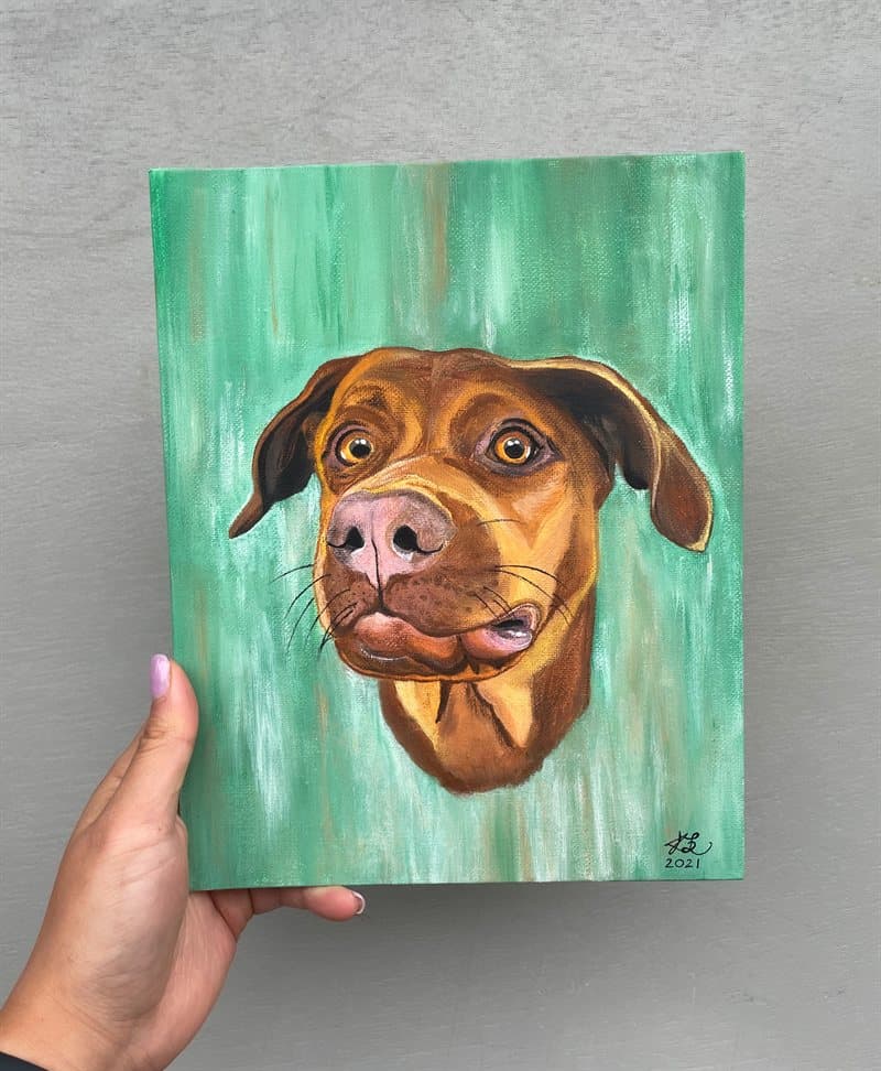 Hand-painted brown Labrador portrait on canvas with a green background